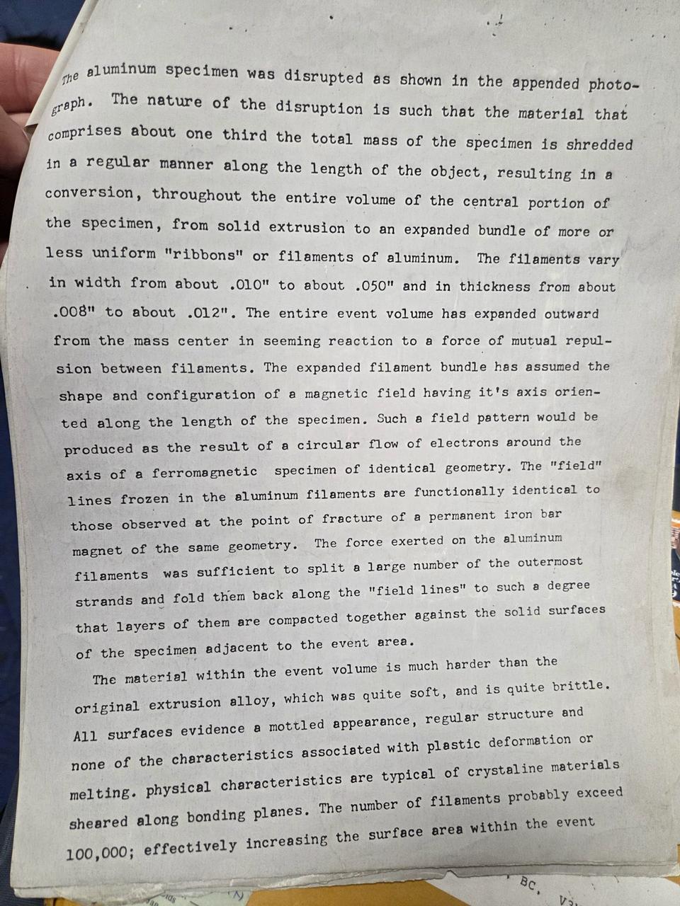 Typed page describing how the aluminum specimen was shredded into an expanded bundle of more than 100,000 ribbon-like filaments, with the material hardened and brittle.