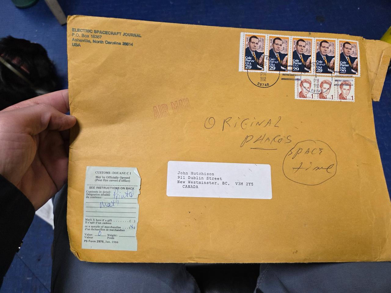 Mailing envelope from the Electric Spacecraft Journal addressed to John Hutchison in New Westminster, BC, marked "Original Pharos" and "Space time".